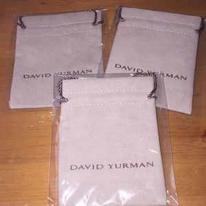 Three David Yurman jewelry bags